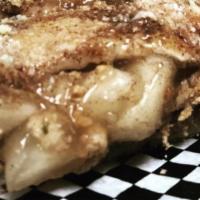 Apple Pie Calzone · Folded dough filled with apple pie filling and graham cracker. Topped with cinnamon butter a...