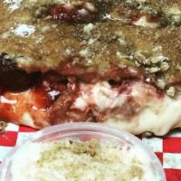 Cherry Cheesecake Calzone · Folded dough filled with cheesecake filling, graham crackers and cherry pie filling. Topped ...
