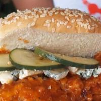 Buffalo Fried Chicken Sandwich · buffalo sauced up fried chicken breast, bleu cheese crumbles, slaw, housemade pickles, & kew...