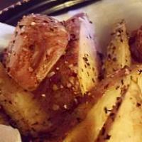 Potato Wedges · salt & peppered hand-cut potato wedges with ketchup