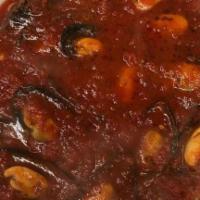 Mussels Marinara · Served over spaghetti.