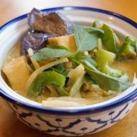 Green Curry · Spicy. Bell peppers, eggplant, bamboo shoot, string bean , basil leaves and coconut milk. Ad...