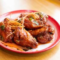 Sriracha Wings · Spicy. Deep-fried chicken wings coated with house sriracha sauce.