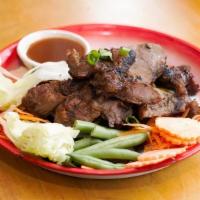 Koo Moo Yang Bbq Pork · Grilled marinated pork with spicy tamarind lime dipping sauce.