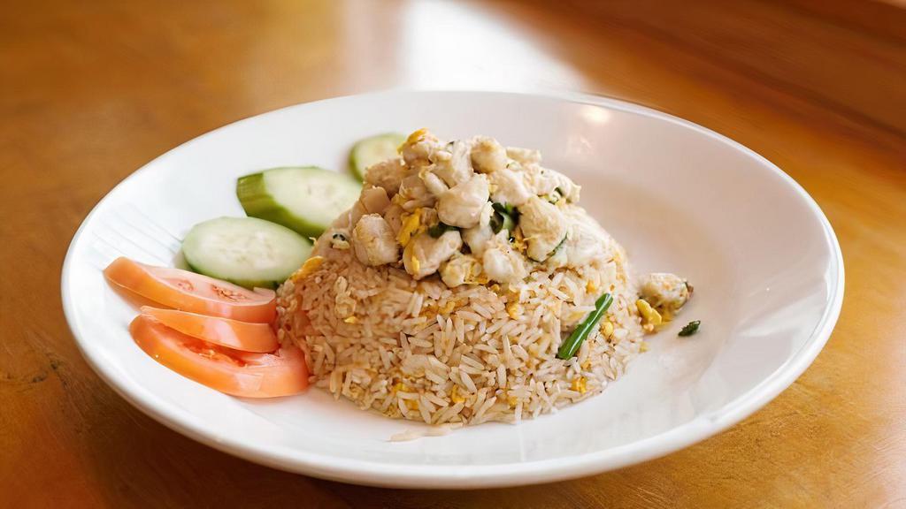 Khao Pad Poo · Fried rice with lump crab meat onion, scallion, and egg.  Add chicken, tofu, vegetable, beef, shrimp, seafood for an additional charge.