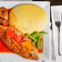 Fried Whole Red Snapper · Served in a red sauce with sautéed onions and peppers.