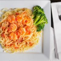 Shrimp With Angel Hair Pasta · Served in a red sauce made with garlic and tomato sautéed in olive oil.