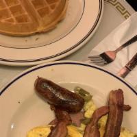 Belgian Waffle Deluxe · Belgian waffle deluxe served with ham, bacon, sausage and one egg.