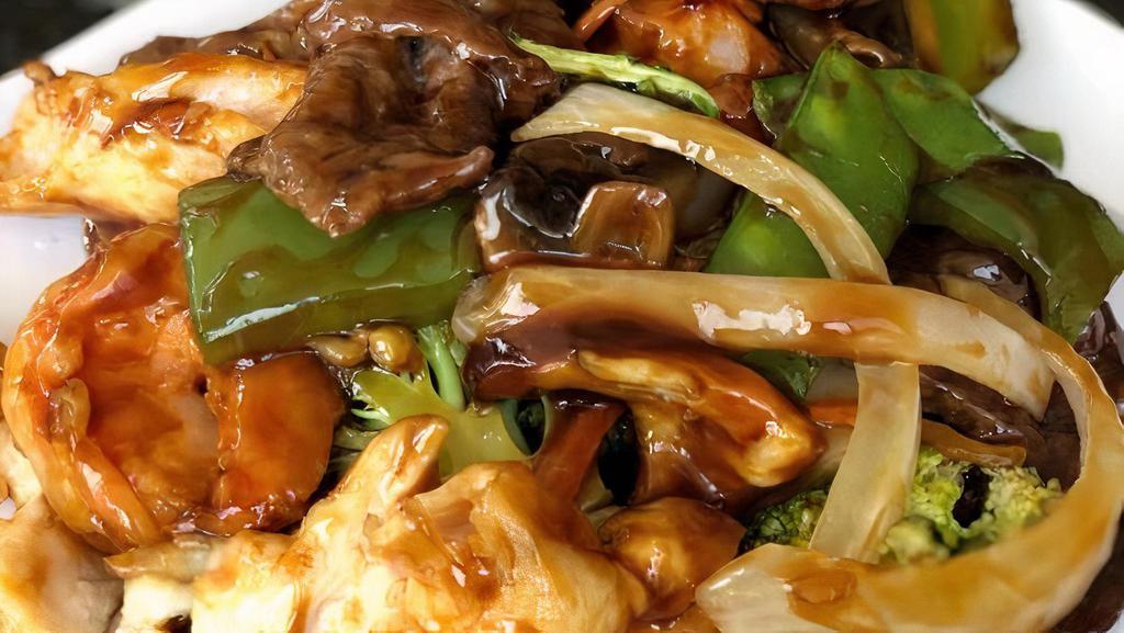 Triple Delight · Beef, chicken, shrimp, sautéed with mixed vegetables in chef’s special sauce.