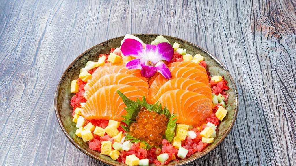 Salmon Chirashi Bowl · 8 oz fresh salmon, tuna ground, ikura, tobiko, tamago, cucumber, shredded nori, pickled ginger, wasabi.