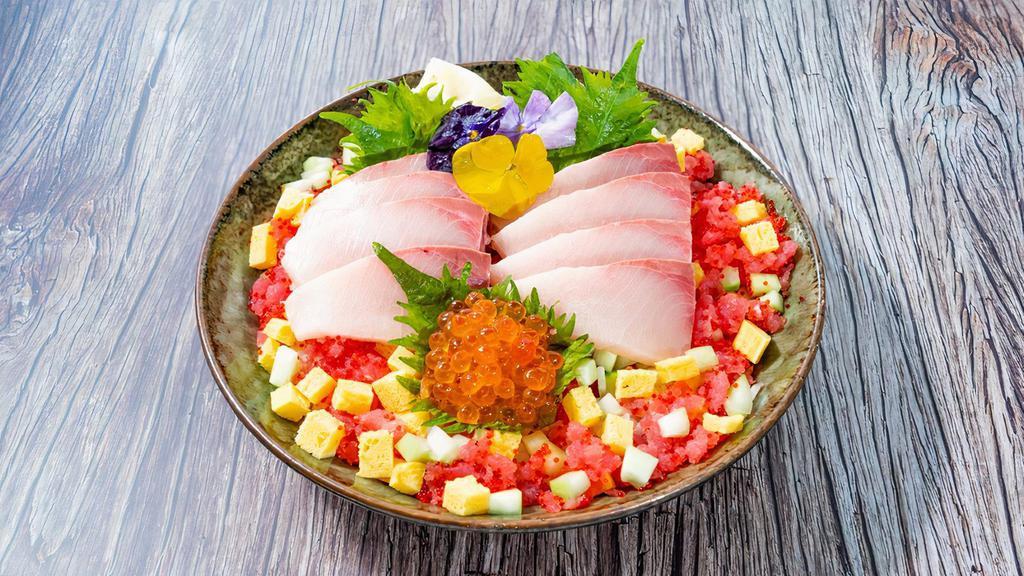 Yellowtail Chirashi Bowl · 8 oz yellowtail, tuna ground, ikura, tobiko, tamago, cucumber, shredded nori, pickled ginger, wasabi.