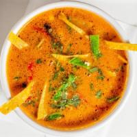 Tortilla Soup · Soup made with fried corn tortilla and seasoned tomato broth.