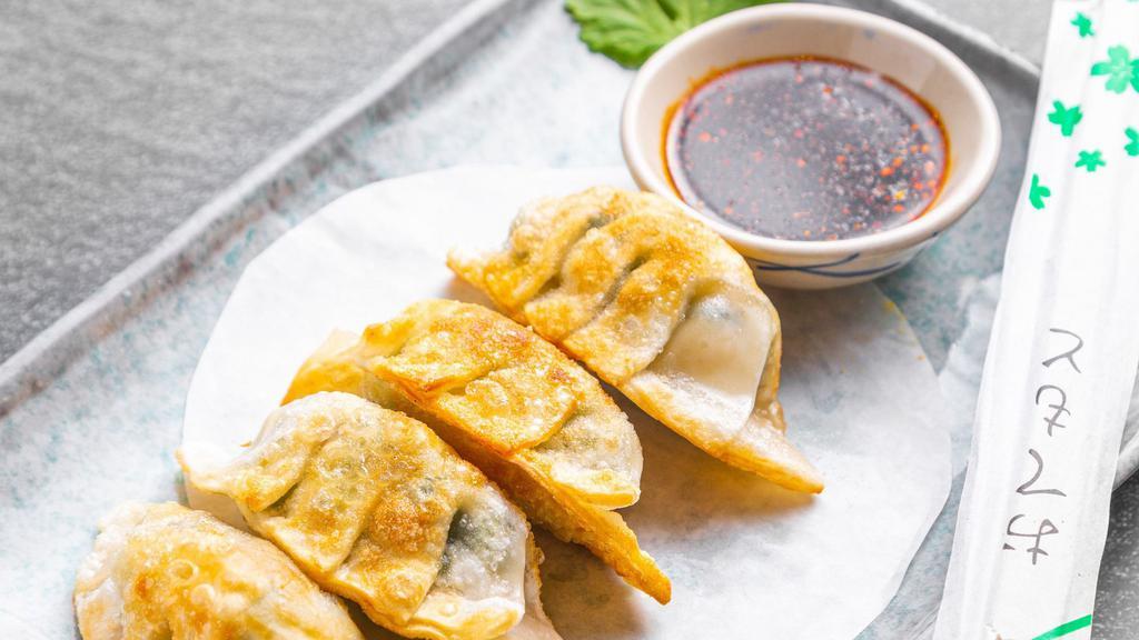 Vegetable Pan Fried Dumpling · Pan fried dumplings filled with sweet corn, carrot, green pea, and chives.