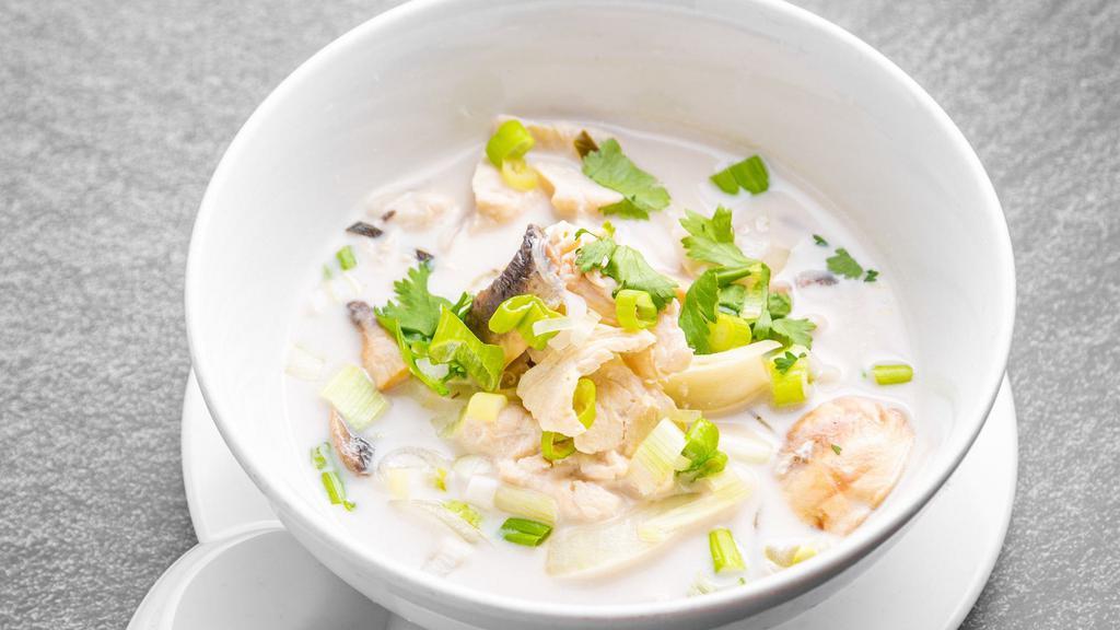 Tom Kha Soup · Coconut milk soup with galangal, lime juice, mushroom, onion, and kaffir lime leaves.