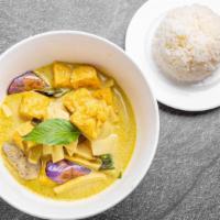 Green Curry · Green curry with bamboo shoots, basil, coconut milk, and eggplant.