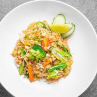 Thai Fried Rice · Jasmine rice with egg, garlic, onion, scallion, tomatoes, and Chinese broccoli.
