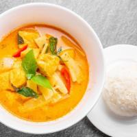 Red Curry · Red curry with bamboo shoots, basil, pepper, coconut milk, kaffir lime leaves and diced wint...