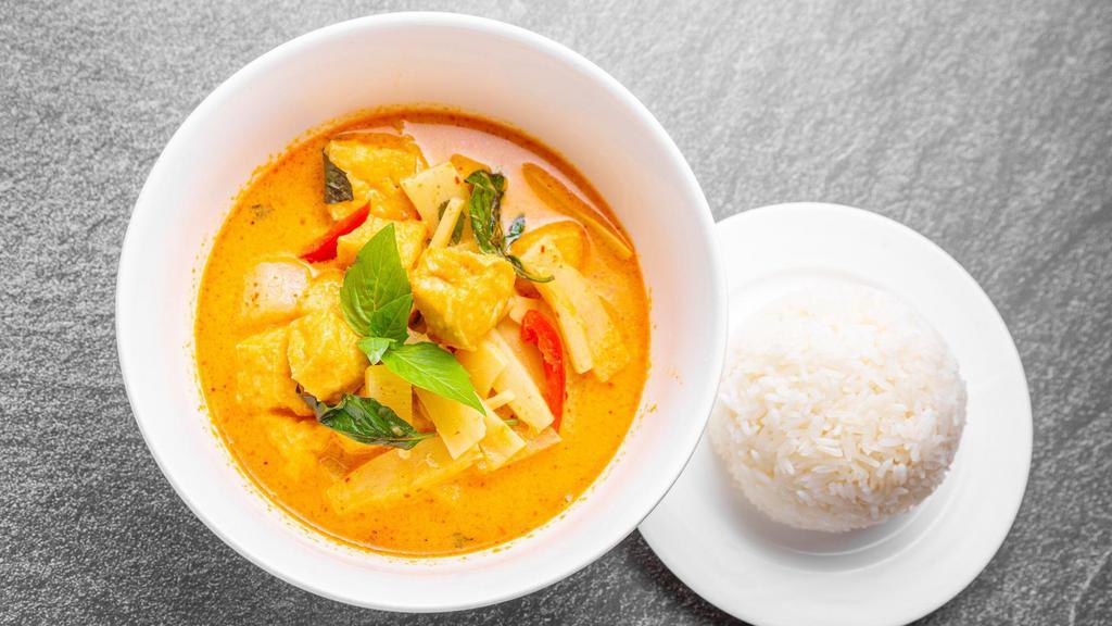 Red Curry · Red curry with bamboo shoots, basil, pepper, coconut milk, kaffir lime leaves and diced winter melon.
