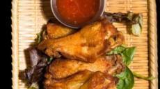 Wings · Fried marinated chicken wings with sweet chili sauce.