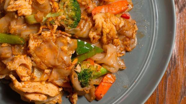 Drunken Noodle · Sauteed flat noodles with eggs, onions, bell peppers, broccoli carrots in spicy basil sauce. Hot and spicy.