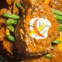 Braised Pork Curry · Slow-cooked pork with thai style panang curry. Hot and spicy.