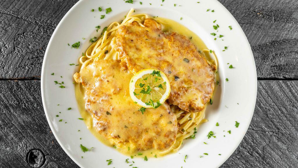 Chicken Francaise · Chicken Breast Sautéed in a Butter Lemon-Wine Sauce Over Rice.