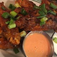 Spicy Wings · 8 wings with our House Made Spicy sauce. Served with bleu cheese and spicy ranch