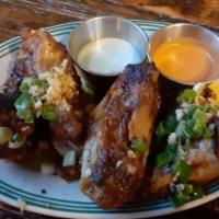 Garlic Wings · 8 wings tossed with Garlic & Herb served with bleu cheese and spicy ranch.