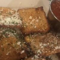 Toasted Ravioli · Crispy breaded ravioli with Pomodoro sauce.