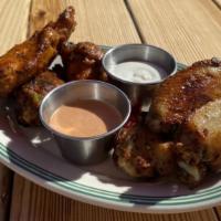 Plain Wings · 8 oven baked wings served with bleu cheese and spicy ranch.