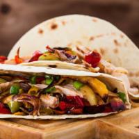 Chicken Fajita Burrito · Filled with rice, beans, mild salsa, sour cream, mix of cheddar and jack cheese, and pico de...