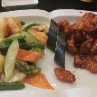 Dragon & Phoenix · Combination of general tso's chicken on the side and jumbo shrimp, mixed vegetables with whi...