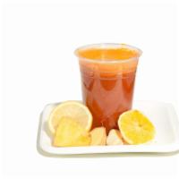 The Sunny P · Orange-Tumeric-Lemon-
Ginger-Garlic-Pineapple