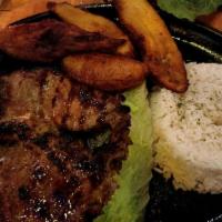 Grilled Skirt Steak · Served with rice, beans with pork and choice of an optional side.