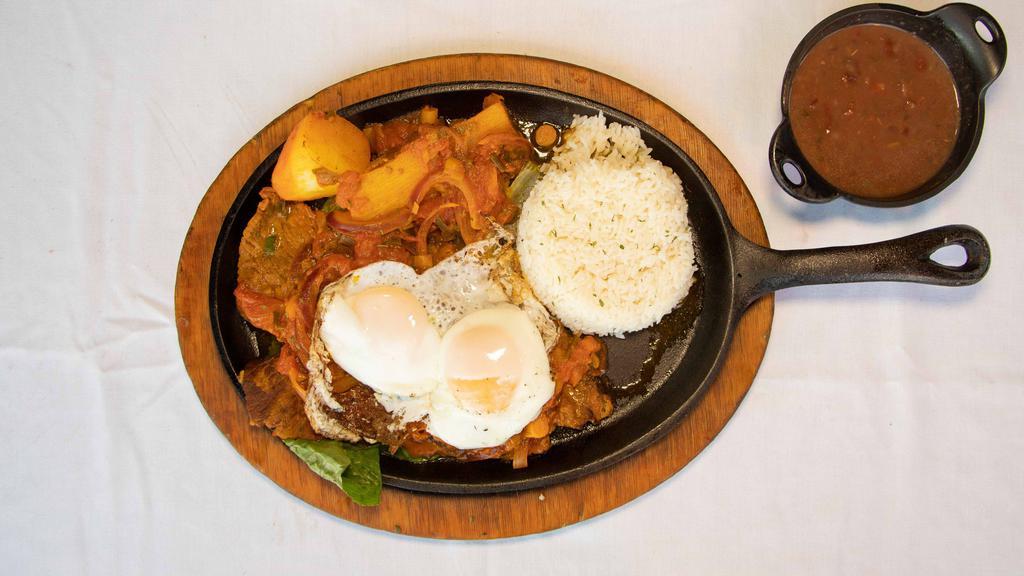 Steak With Creole Sauce & 2 Fried Eggs · Served with rice, beans, fried cassava, and potato.