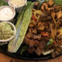 Fajitas · Served with rice and beans with pork.
