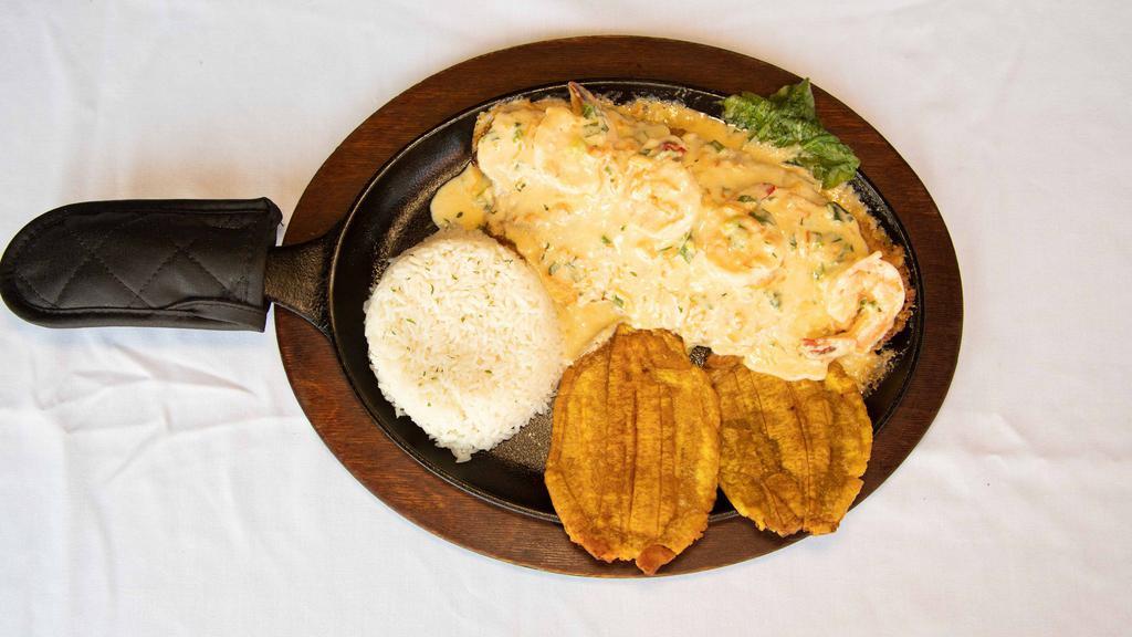 Grilled Fish Fillet With Shrimp Sauce · Served with rice, fried green plantains, and salad.