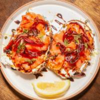 7 Smoked Salmon Toast · House-designed dill cream cheese spread, smoked salmon, carmelized pickled onions, capers, l...