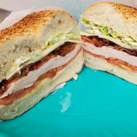 Turkey Club · Ovengold Turkey, Swiss, Bacon, lettuce, tomato and mayo