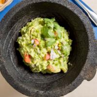 Guacamole En Molcajete · Our famous table-side preparation. Fresh avocado, jalapeno, tomato, onion and cilantro. Serv...