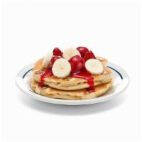 Strawberry Banana Protein Pancakes- (Short Stack) · A fresh-flipped power stack. two protein pancakes filled with fresh banana slices. Topped wi...