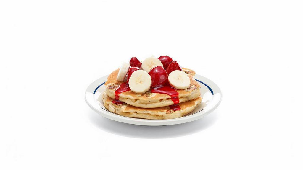 Strawberry Banana Protein Pancakes- (Short Stack) · A fresh-flipped power stack. two protein pancakes filled with fresh banana slices. Topped with glazed strawberries & more banana slices.