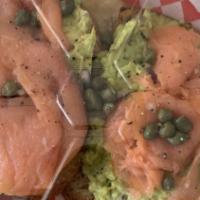 Smoked Salmon Avocado Toast · Avocado Toast, topped with smoked salmon, red onions, and capers. On your choice of toast.