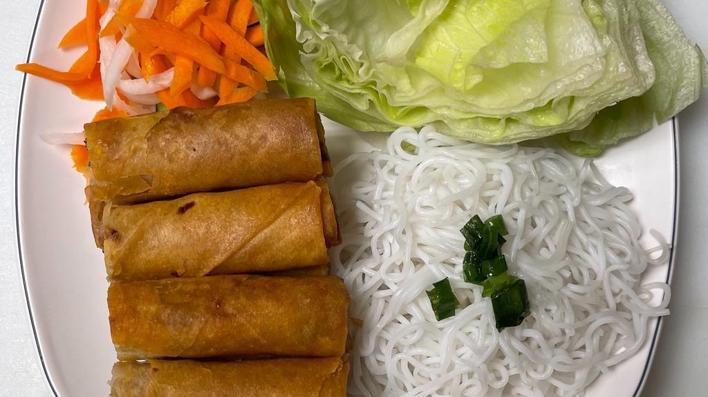 Spring Regular Roll (4) · Deep-fried egg roll filled with ground chicken, carrot, onion, long rice, and taro served with lettuce, pickles, rice noodle, cucumber, and nuoc mam sauce.