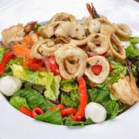 Grilled Shrimp And Calamari Salad · Marinated grilled shrimp and calamari, fresh mozzarella cheese, roasted peppers, olives and ...
