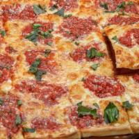 Grandma Thin Crust Pan Pizza · Layered with mozzarella cheese and spotted with flavorful herbs and plum tomato sauce.
