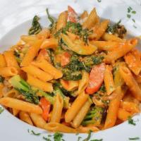 Penne Primavera Pasta · Mixed vegetables in a light pink sauce.