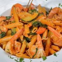 Penne Primavera And Shrimp · Mixed vegetables and shrimp in a light pink sauce.