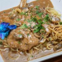 Veal Marsala · Tender veal in a classic marsala wine sauce with fresh mushrooms. Served with side salad, yo...