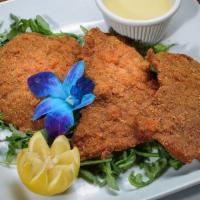 Veal Milanese · Breaded veal cutlet, pan-fried and served with lemon wedges. Served with side salad, your ch...